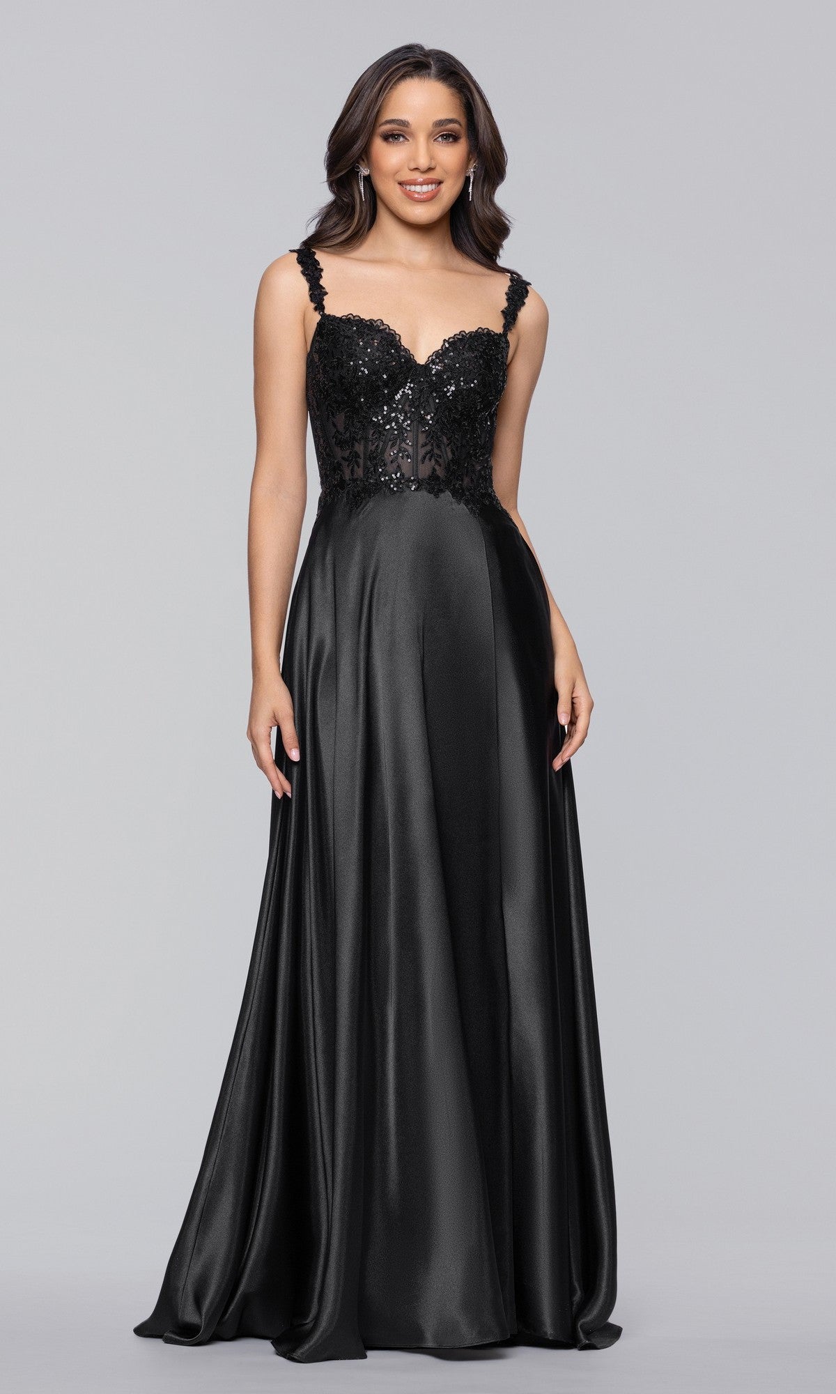 A woman wears the Blondie Nites 6088BN Long Prom Dress, featuring an elegant A-line satin design with a sequin-embellished bodice, sweetheart neckline, and a flowing skirt.